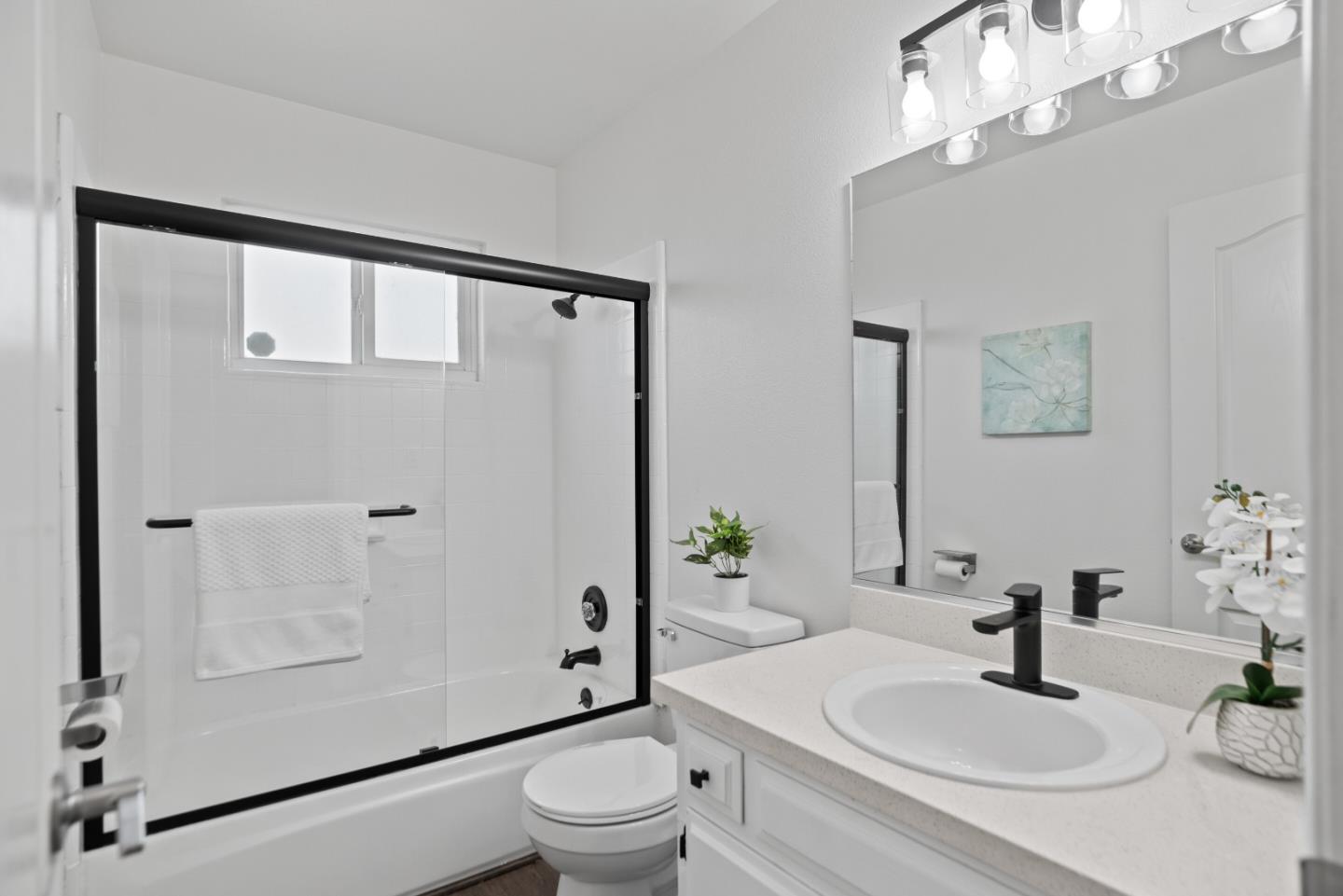 773 Andrea Way Pittsburg, CA 94565 - Photo 21 of 35 a bathroom with a sink a mirror a toilet and shower