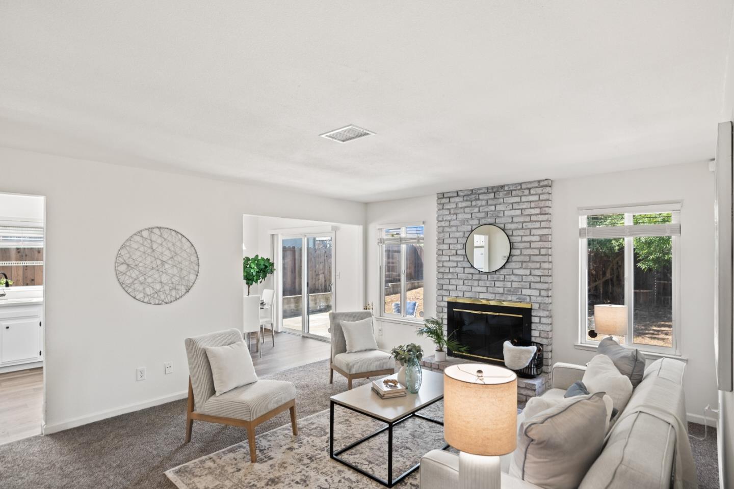 773 Andrea Way Pittsburg, CA 94565 - Photo 3 of 35 a living room with furniture a clock and a fireplace