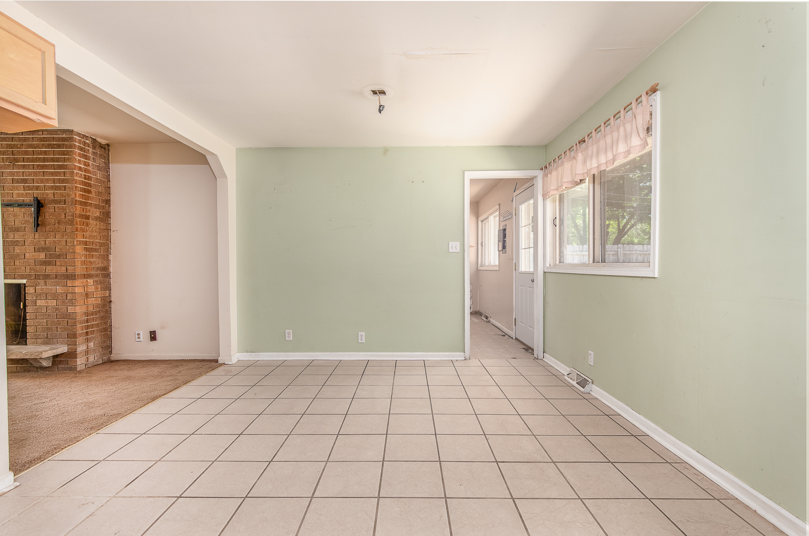 18 Greenbriar Road Montgomery, IL 60538 - Photo 11 of 27 a view of an empty room with window and chandelier fan
