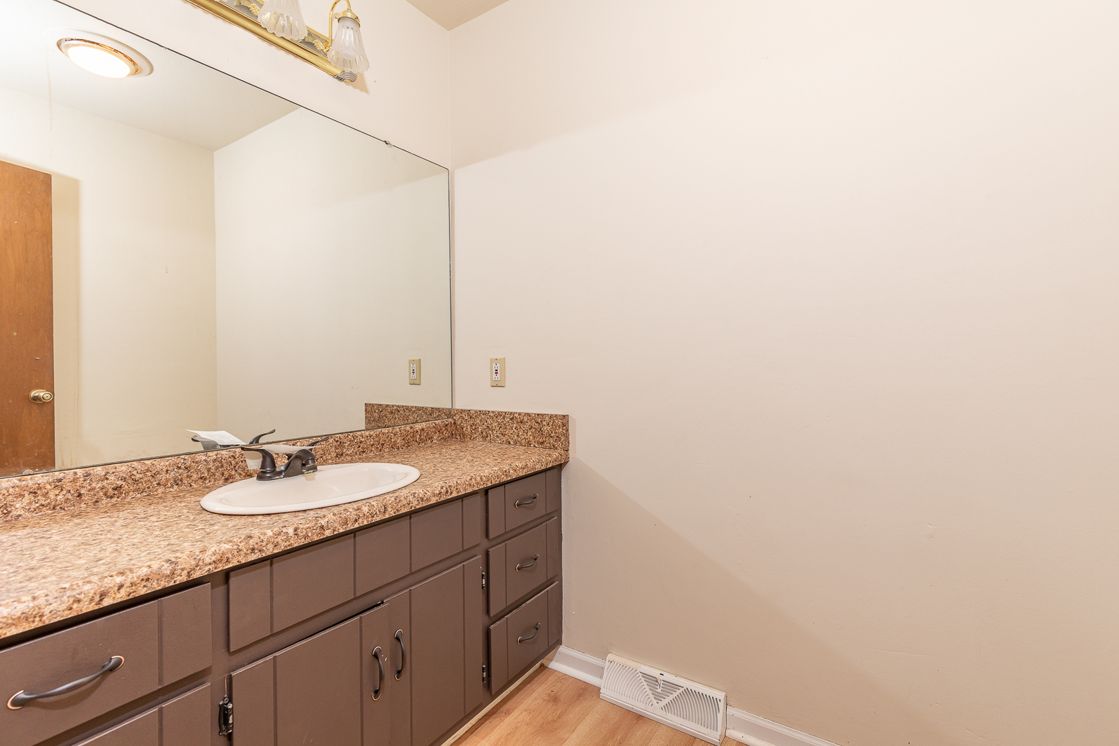 18 Greenbriar Road Montgomery, IL 60538 - Photo 12 of 27 a bathroom with a granite countertop sink and a mirror