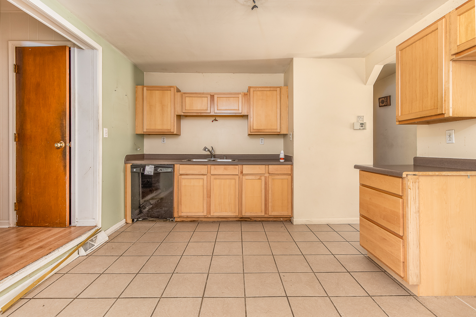 18 Greenbriar Road Montgomery, IL 60538 - Photo 9 of 27 a kitchen with a stove a sink and a refrigerator