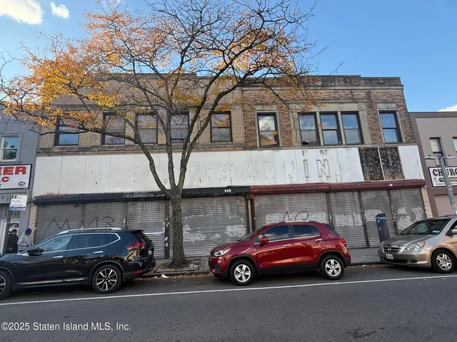 a view of parking space with parked cars