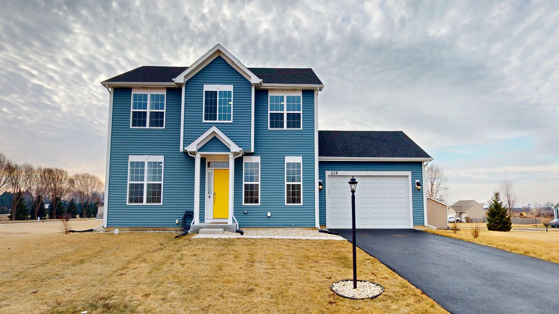 219 Deer Run Trail Poplar Grove, IL 61065 - Photo 1 of 30 a front view of a house with a yard