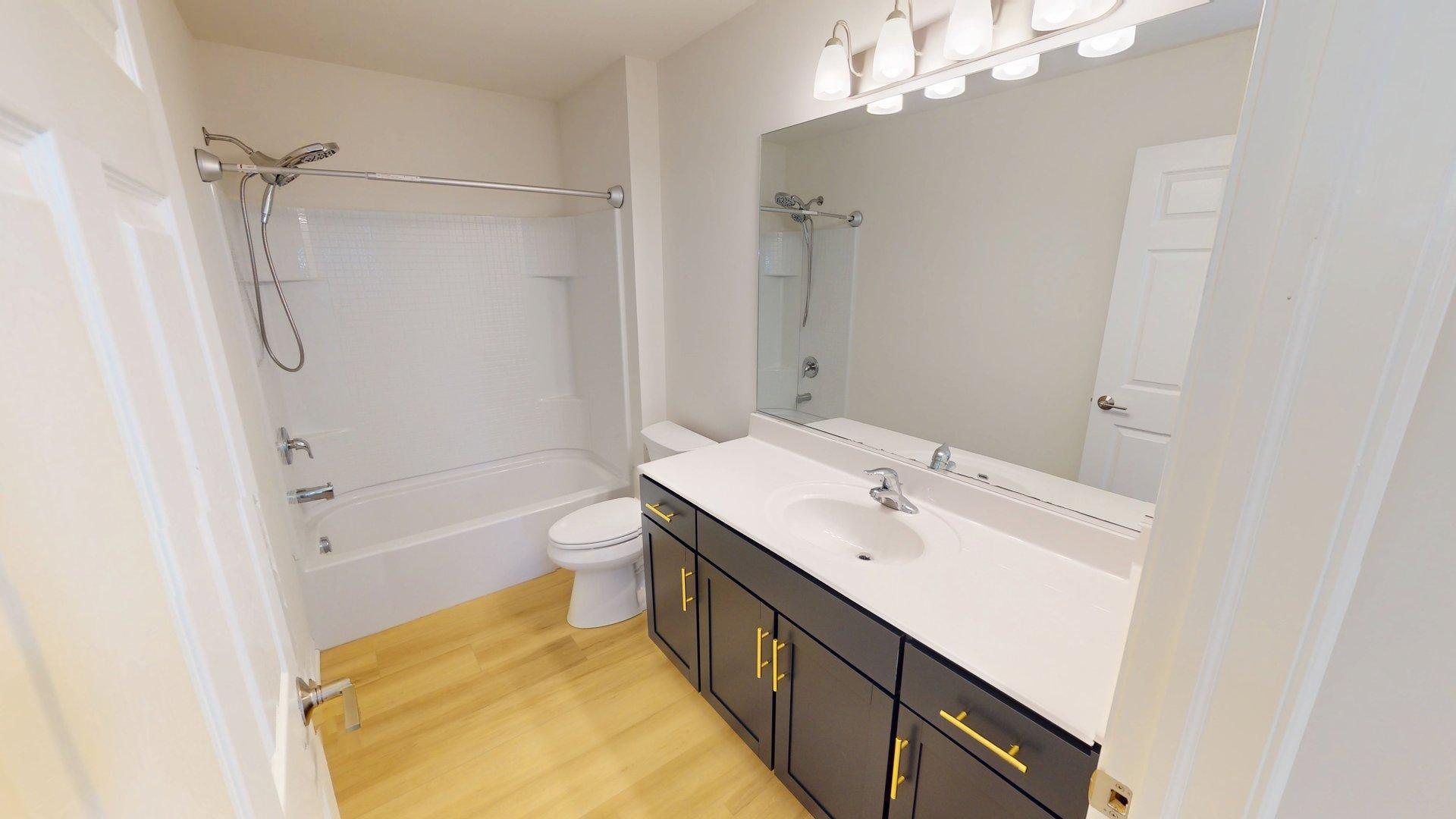 219 Deer Run Trail Poplar Grove, IL 61065 - Photo 28 of 30 a bathroom with a sink a toilet and shower