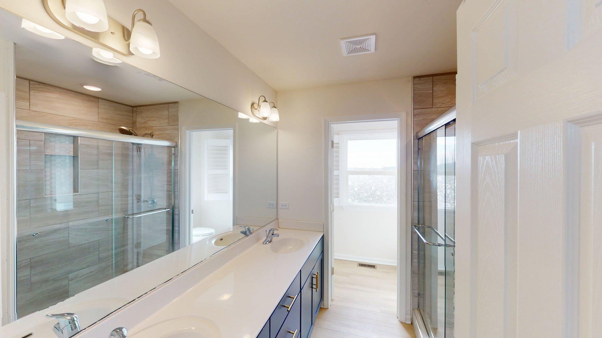 219 Deer Run Trail Poplar Grove, IL 61065 - Photo 29 of 30 a bathroom with a double vanity sink and mirror