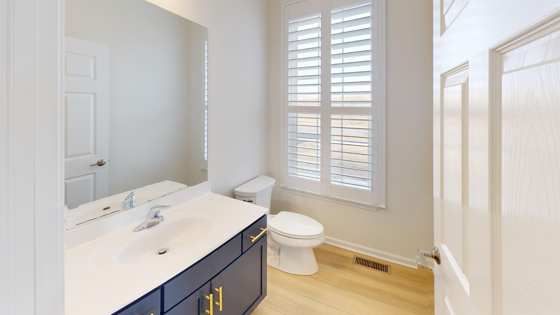 219 Deer Run Trail Poplar Grove, IL 61065 - Photo 10 of 30 a bathroom with a sink toilet and vanity