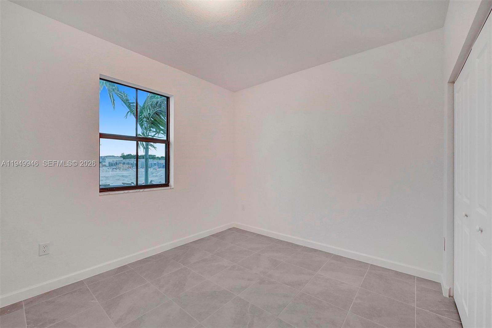 13405 Southwest 285th Street Homestead, FL 33033 - Photo 11 of 59 an empty room with a window