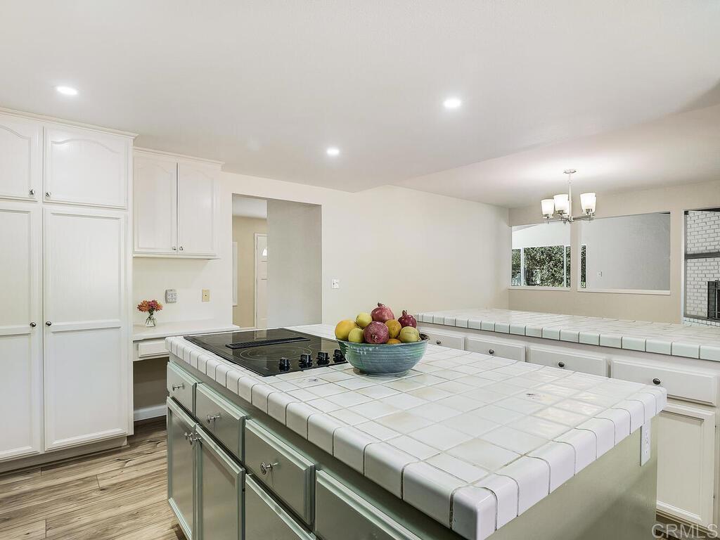2844 Live Oak Park Road Fallbrook, CA 92028 - Photo 18 of 65 a kitchen with a sink a stove and cabinets