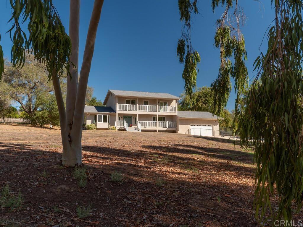 2844 Live Oak Park Road Fallbrook, CA 92028 - Photo 2 of 65 a view of a house with a yard