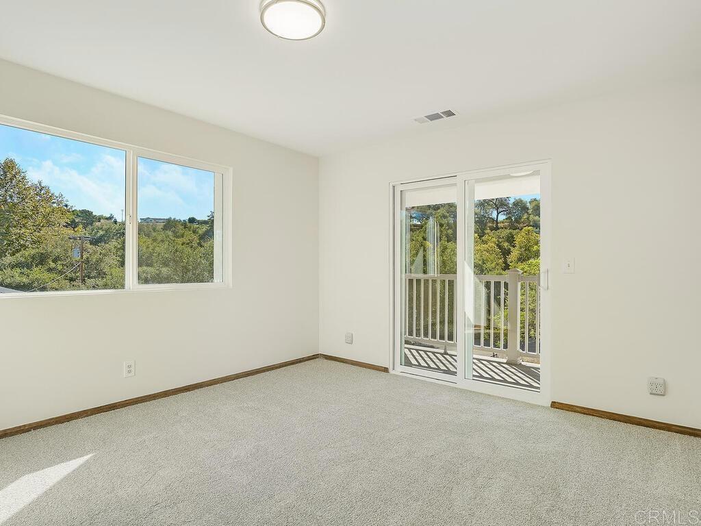 2844 Live Oak Park Road Fallbrook, CA 92028 - Photo 29 of 65 an empty room with large windows