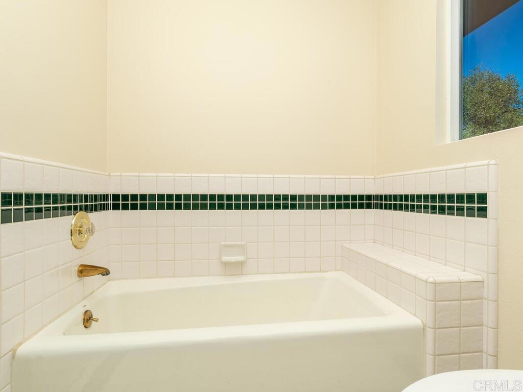 2844 Live Oak Park Road Fallbrook, CA 92028 - Photo 34 of 65 a bathroom with a bathtub