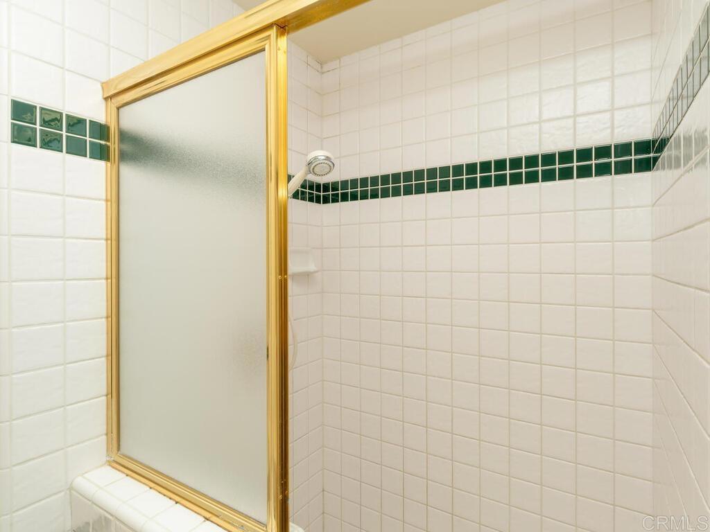 2844 Live Oak Park Road Fallbrook, CA 92028 - Photo 35 of 65 a bathroom with a shower and a glass door