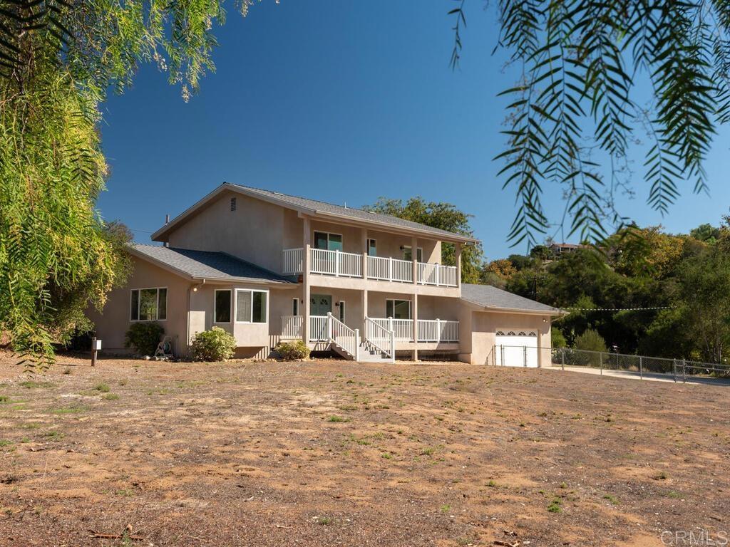 2844 Live Oak Park Road Fallbrook, CA 92028 - Photo 46 of 65 a front view of a house with a yard