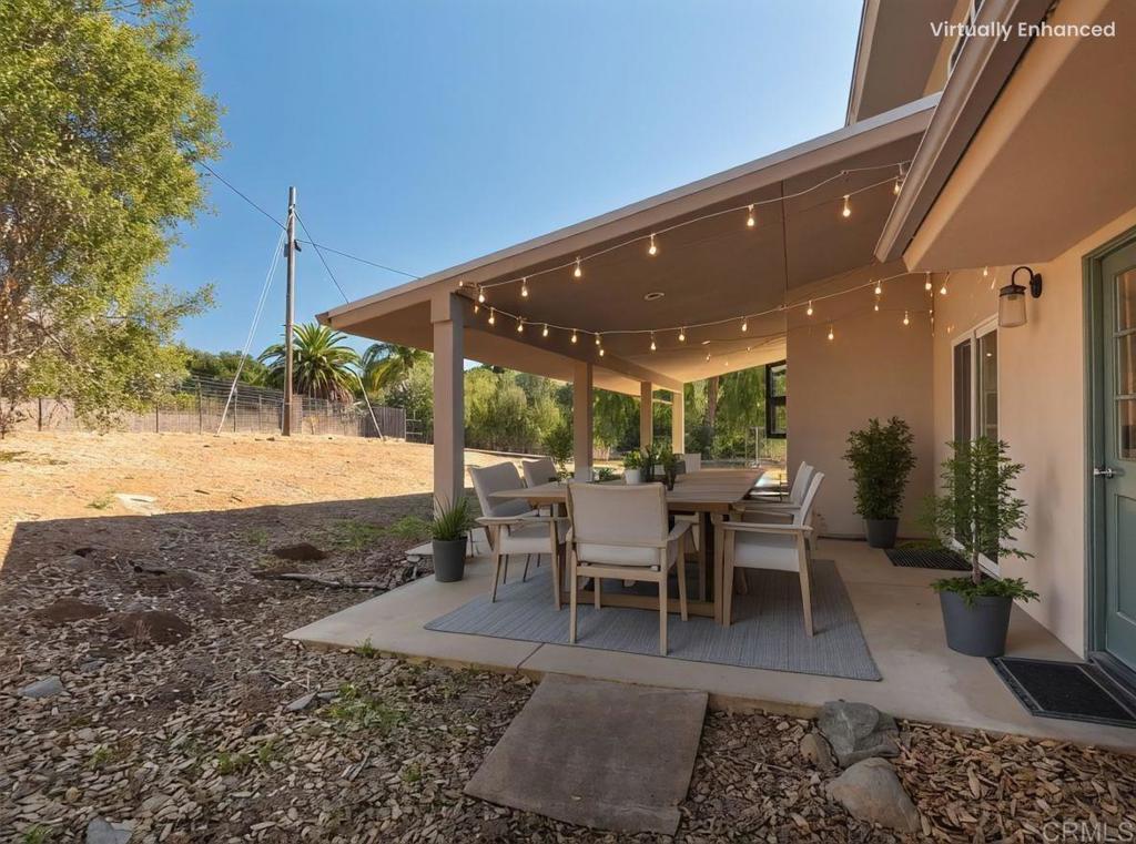 2844 Live Oak Park Road Fallbrook, CA 92028 - Photo 48 of 65 a view of a patio with table and chairs