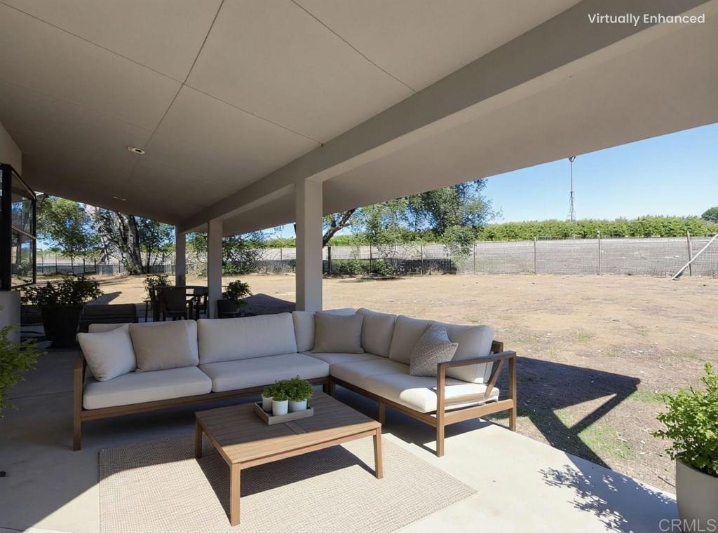 2844 Live Oak Park Road Fallbrook, CA 92028 - Photo 51 of 65 a living room with patio furniture and a floor to ceiling window