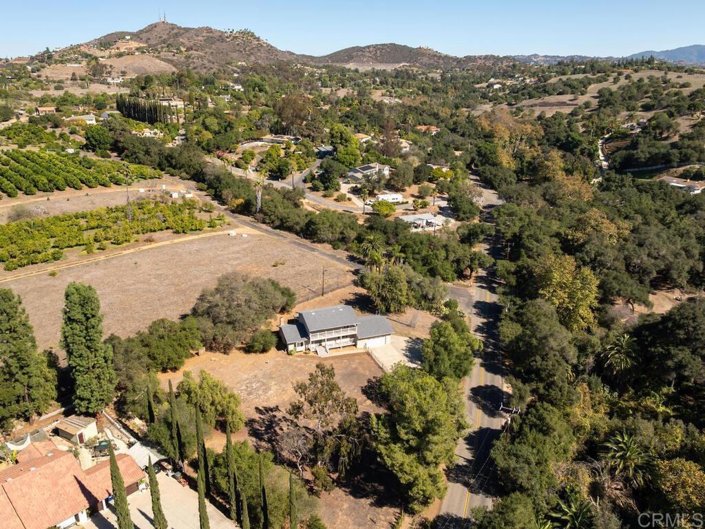 2844 Live Oak Park Road Fallbrook, CA 92028 - Photo 63 of 65 a view of a houses with a lush green hillside