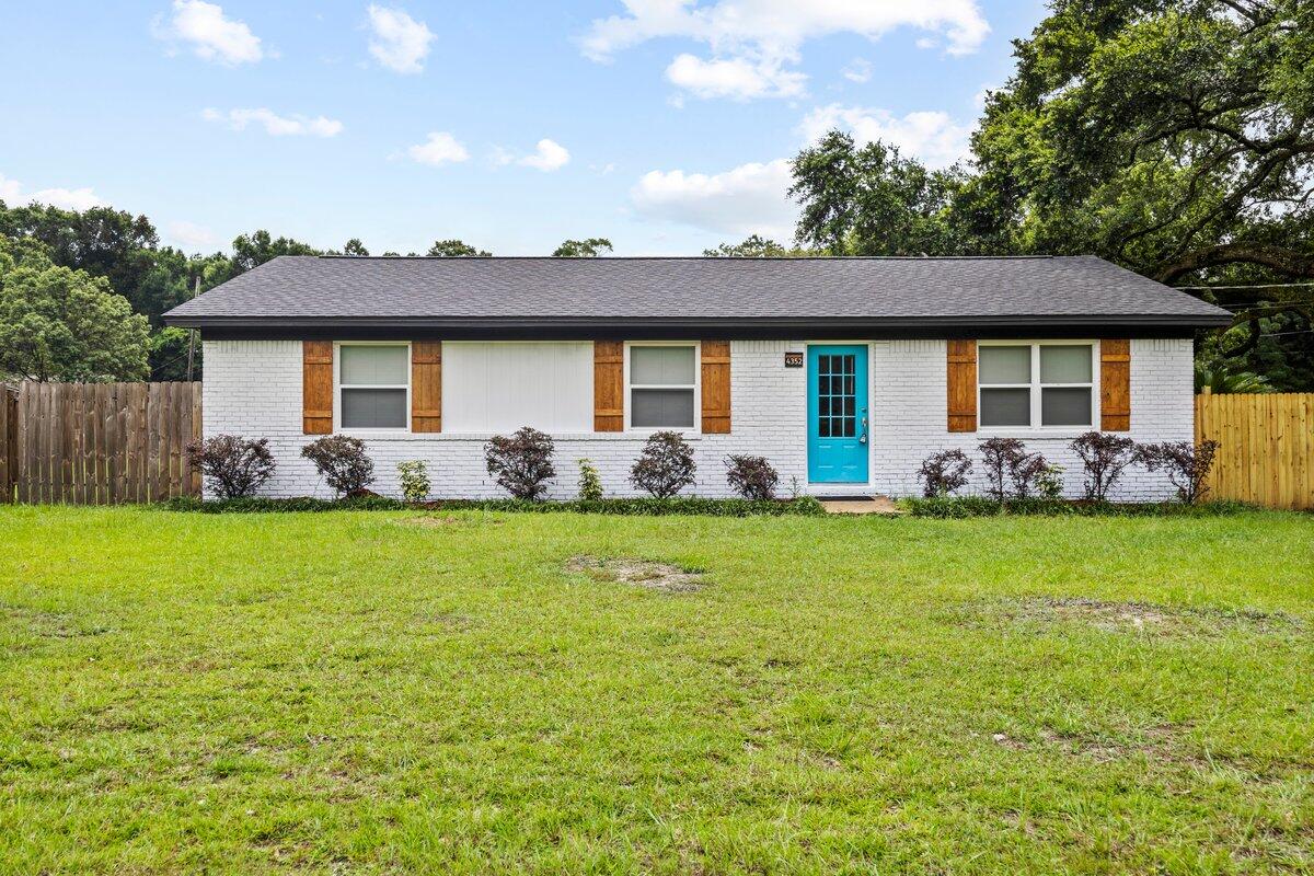 a front view of house with garden