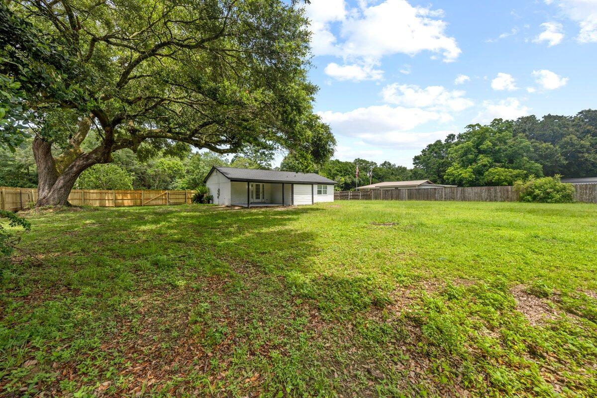 4352 Watkins Street Pace, FL 32571 - Photo 5 of 24 a house view with a garden space