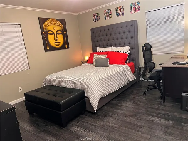 a bedroom with a bed and dresser