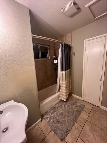 a bathroom with a shower and toilet
