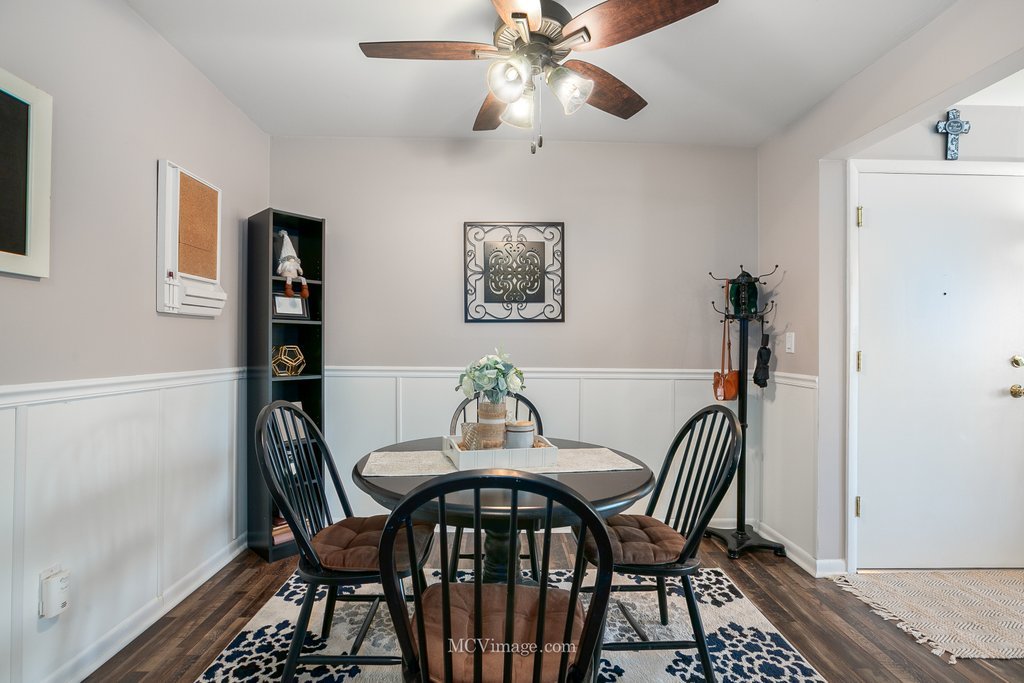 19360 Wolf Road, Unit 10 Mokena, IL 60448 - Photo 12 of 24 a view of a dining room with furniture and wooden floor