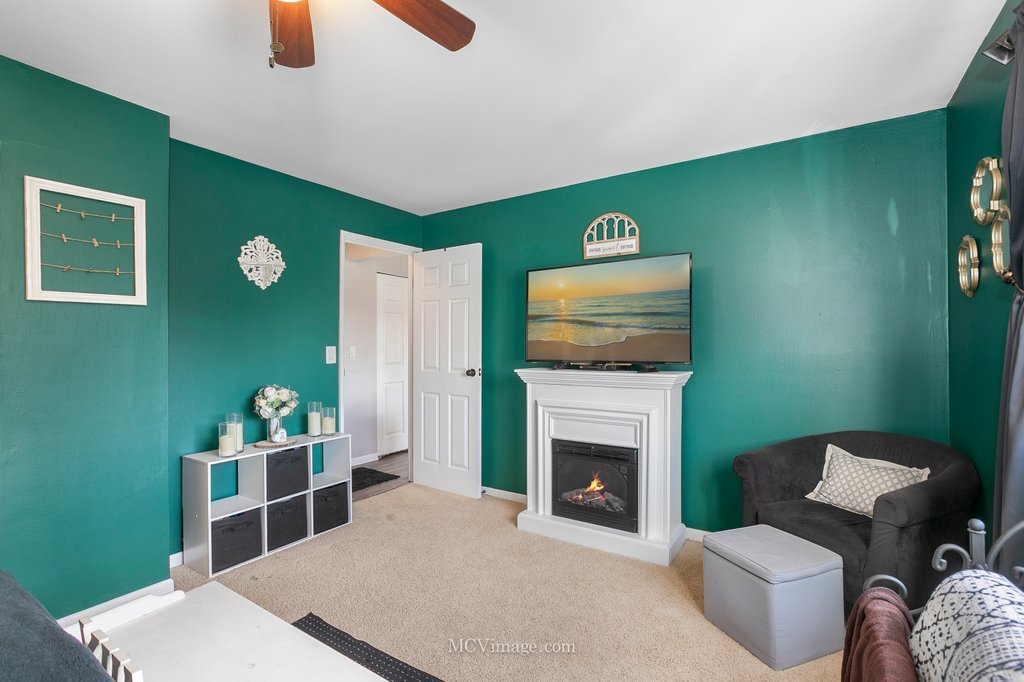 19360 Wolf Road, Unit 10 Mokena, IL 60448 - Photo 15 of 24 a living room with furniture and a fireplace