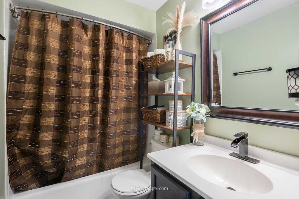 19360 Wolf Road, Unit 10 Mokena, IL 60448 - Photo 16 of 24 a bathroom with a sink a toilet and shower