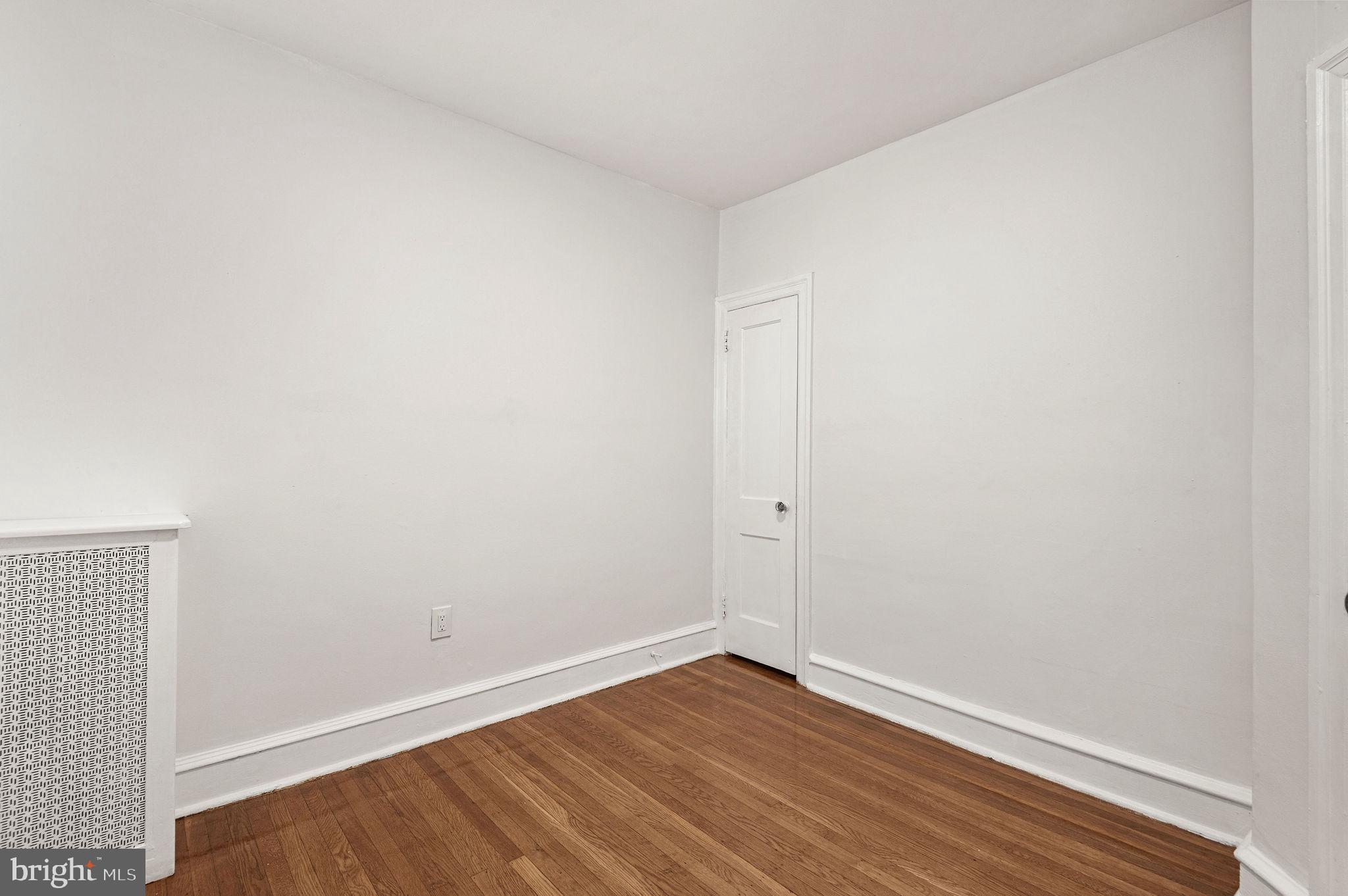 243 East Sheldon Street Philadelphia, PA 19120 - Photo 13 of 23 a view of an empty room with wooden floor