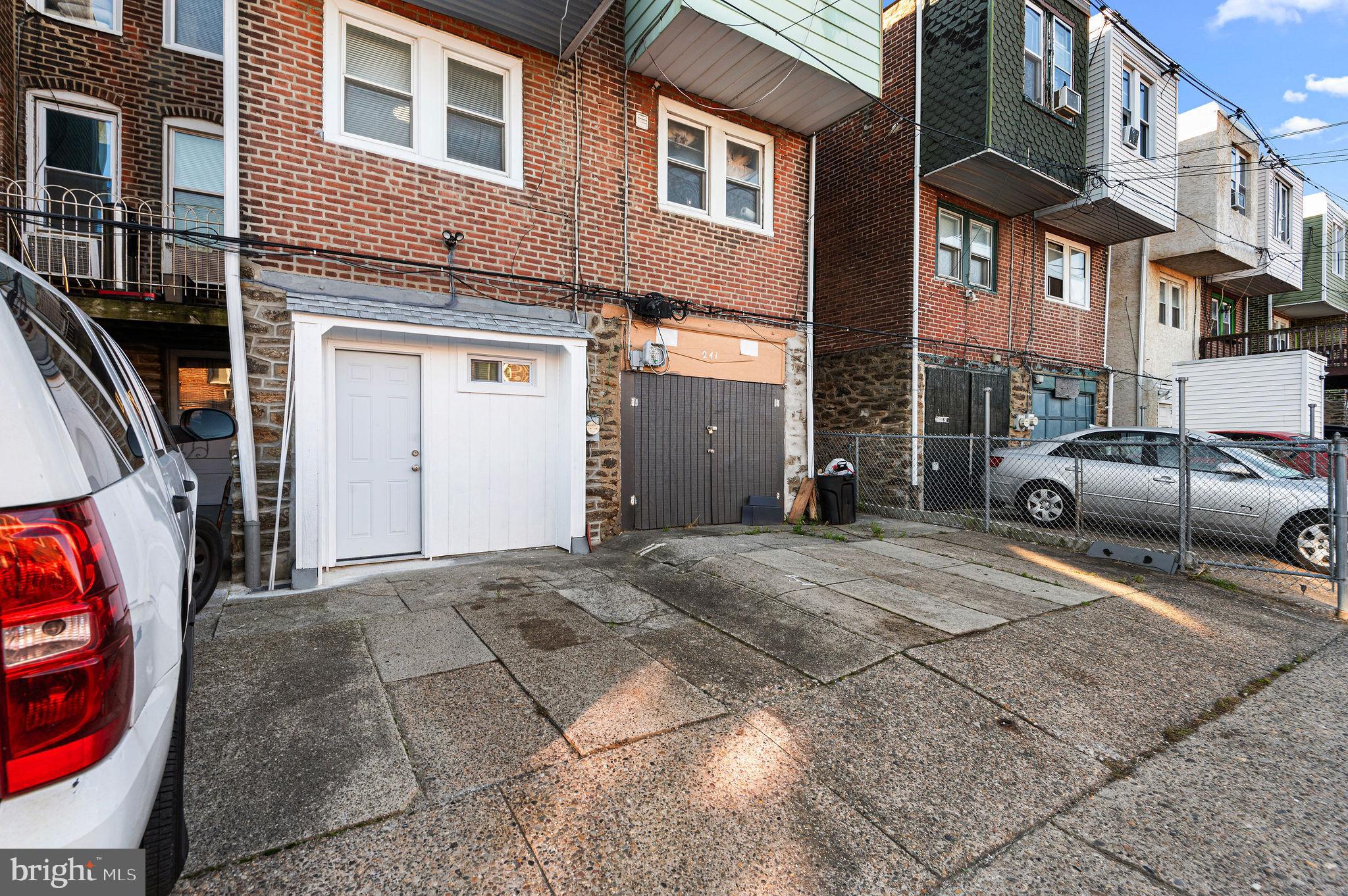 243 East Sheldon Street Philadelphia, PA 19120 - Photo 23 of 23 a couple of cars parked in front of a building