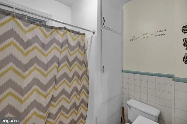 a bathroom with a shower and a sink