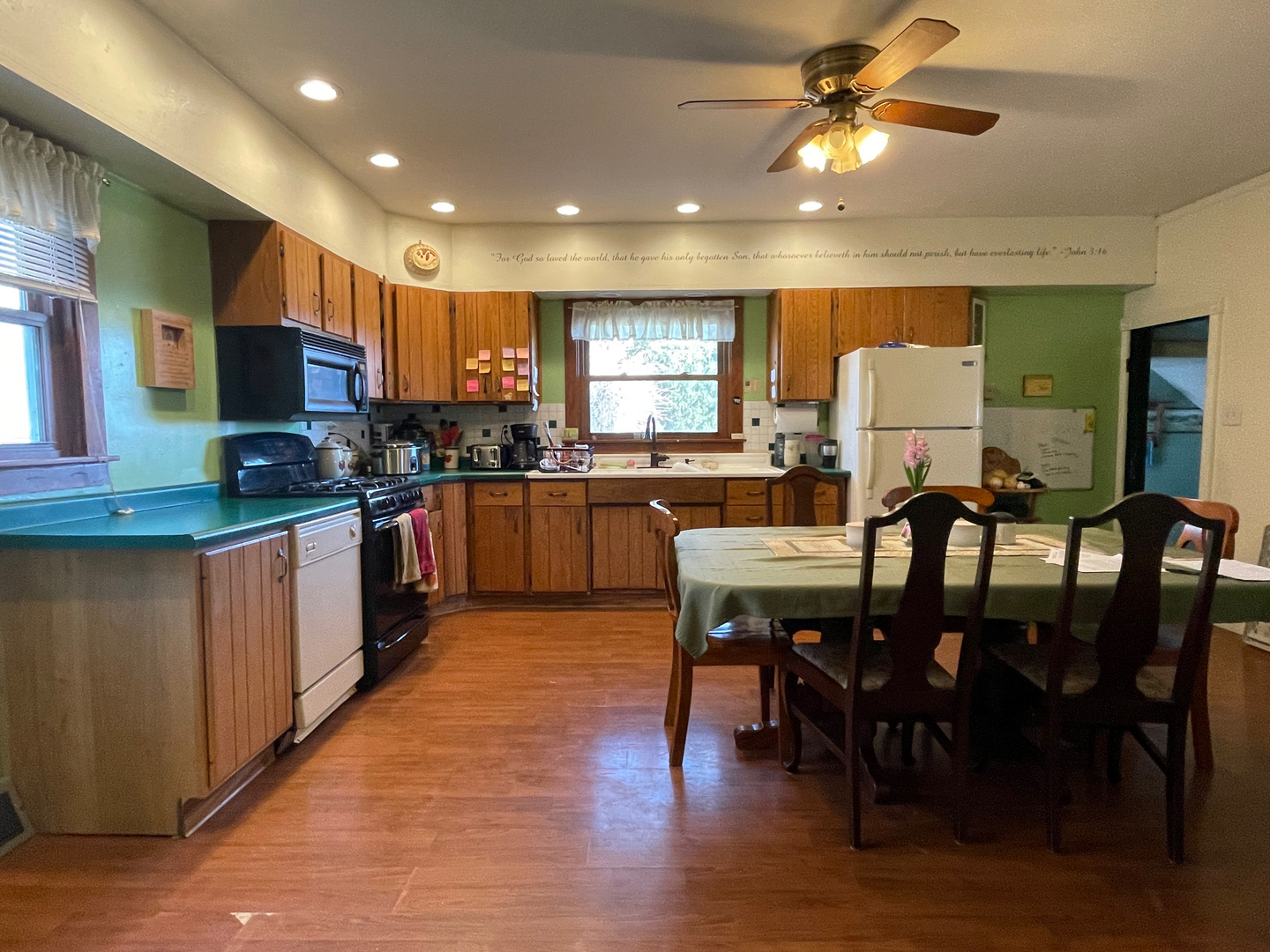 1733 Plock Road Dixon, IL 61021 - Photo 13 of 23 a large kitchen with a table and chairs