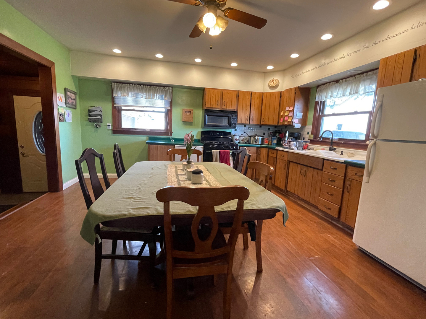 1733 Plock Road Dixon, IL 61021 - Photo 14 of 23 a kitchen with a dining table chairs and refrigerator
