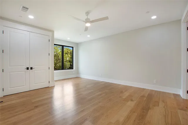 a bathroom with a double vanity sink toilet mirror and bathtub