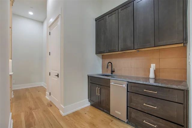 a kitchen with a sink and cabinets