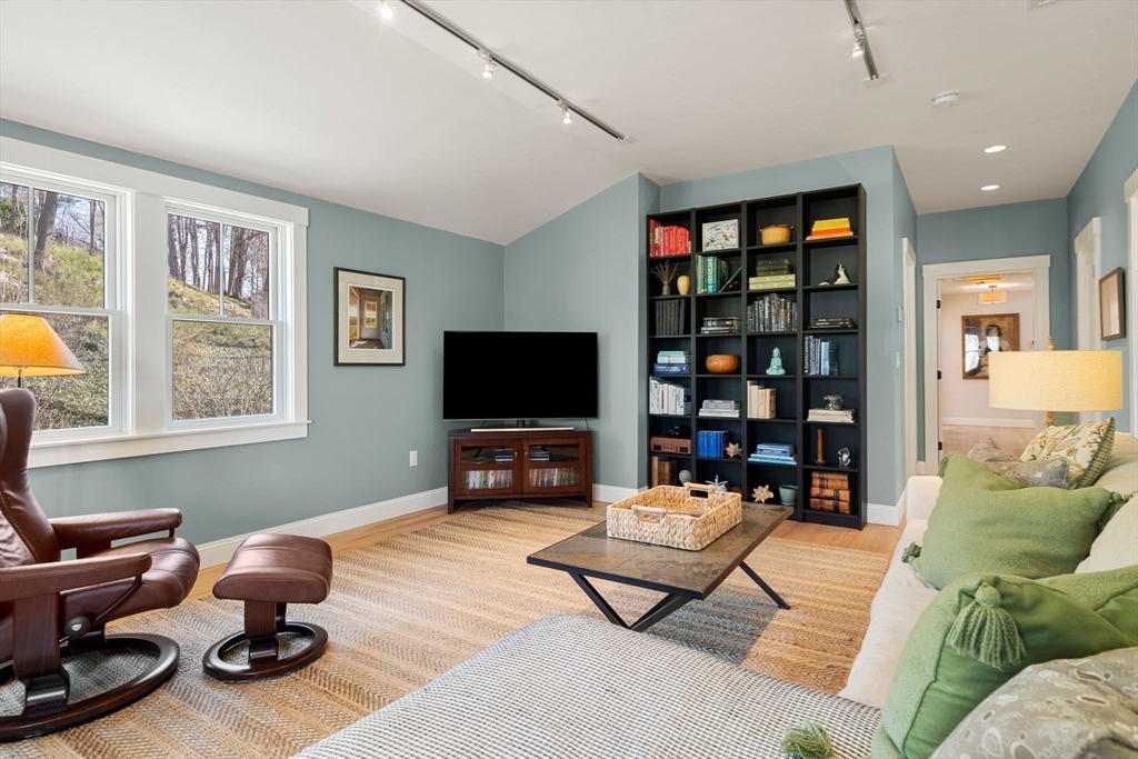 7 Bradlee Road Marblehead, MA 01945 - Photo 27 of 41 a living room with furniture a window and a flat screen tv