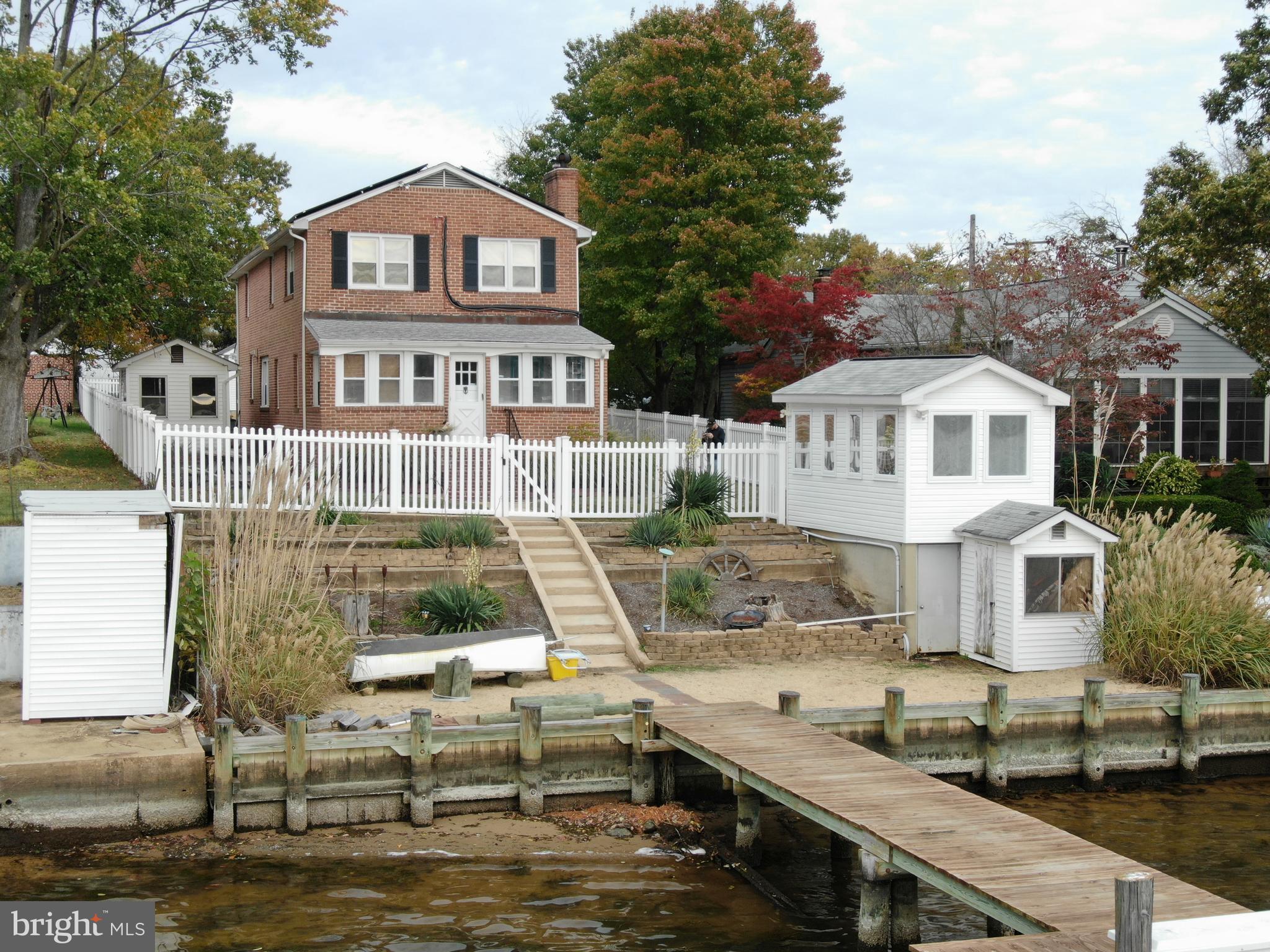 418 Carvel Beach Road Curtis Bay, MD 21226 - Photo 13 of 54 a front view of a house with a yard