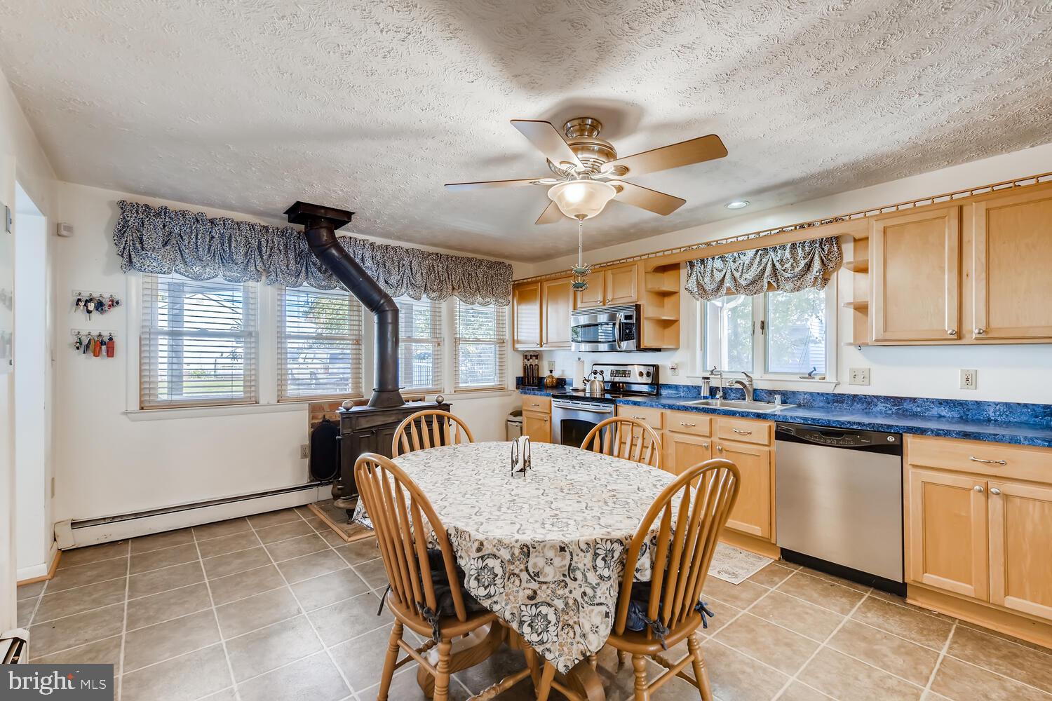 418 Carvel Beach Road Curtis Bay, MD 21226 - Photo 21 of 54 a view of a dining room with furniture window and wooden floor