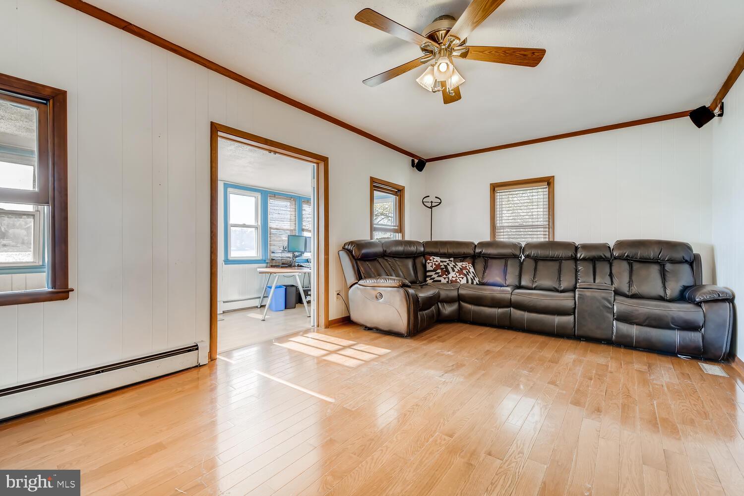 418 Carvel Beach Road Curtis Bay, MD 21226 - Photo 25 of 54 a spacious bedroom with a bed couch and a window