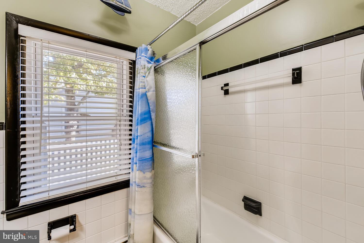 418 Carvel Beach Road Curtis Bay, MD 21226 - Photo 26 of 54 a view of a bathroom with a shower and a window