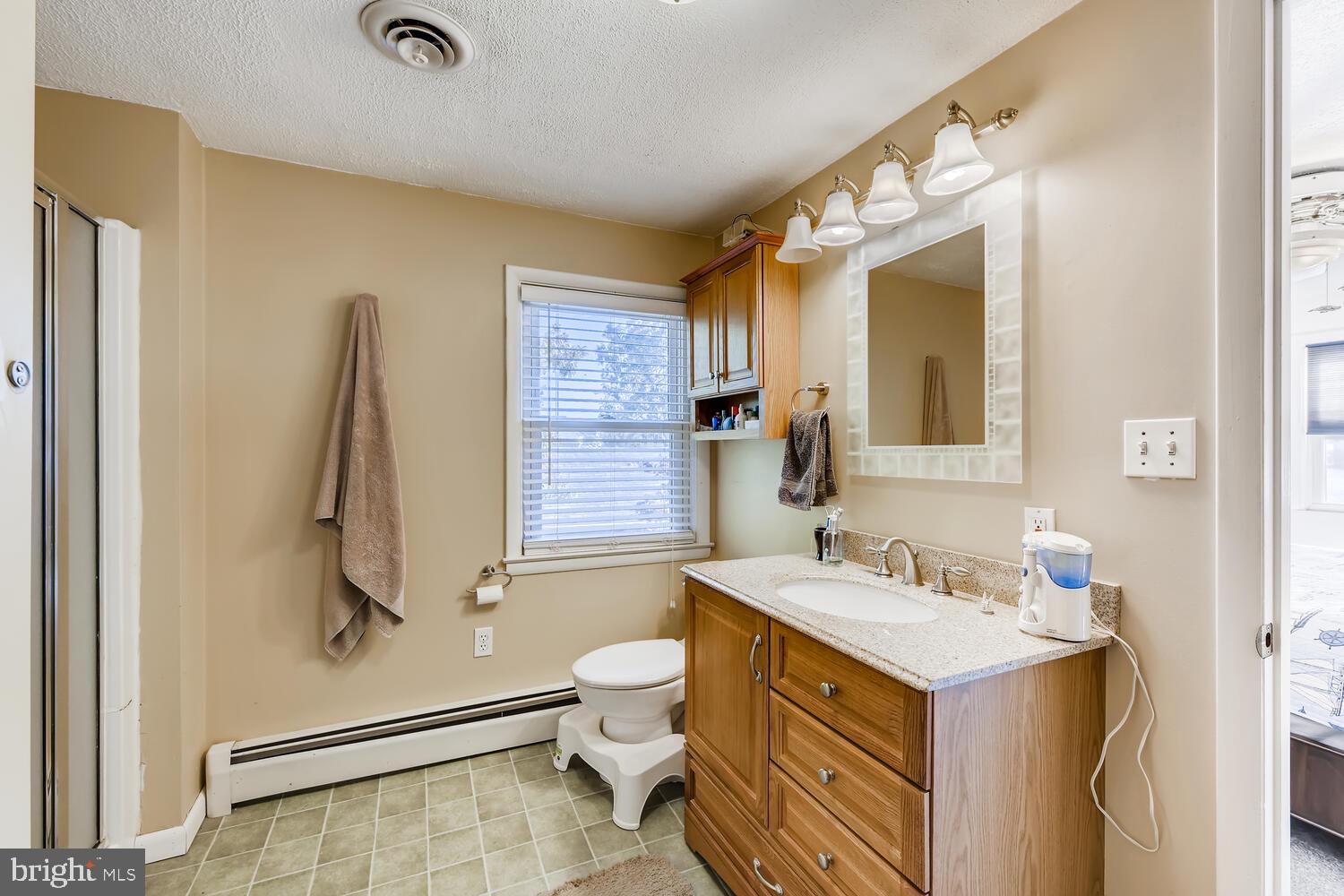418 Carvel Beach Road Curtis Bay, MD 21226 - Photo 30 of 54 a bathroom with a sink toilet and shower