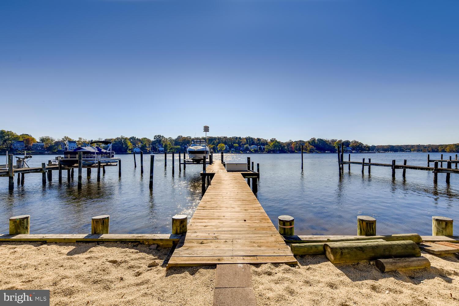 418 Carvel Beach Road Curtis Bay, MD 21226 - Photo 4 of 54 a view of a lake with boats and trees in the background