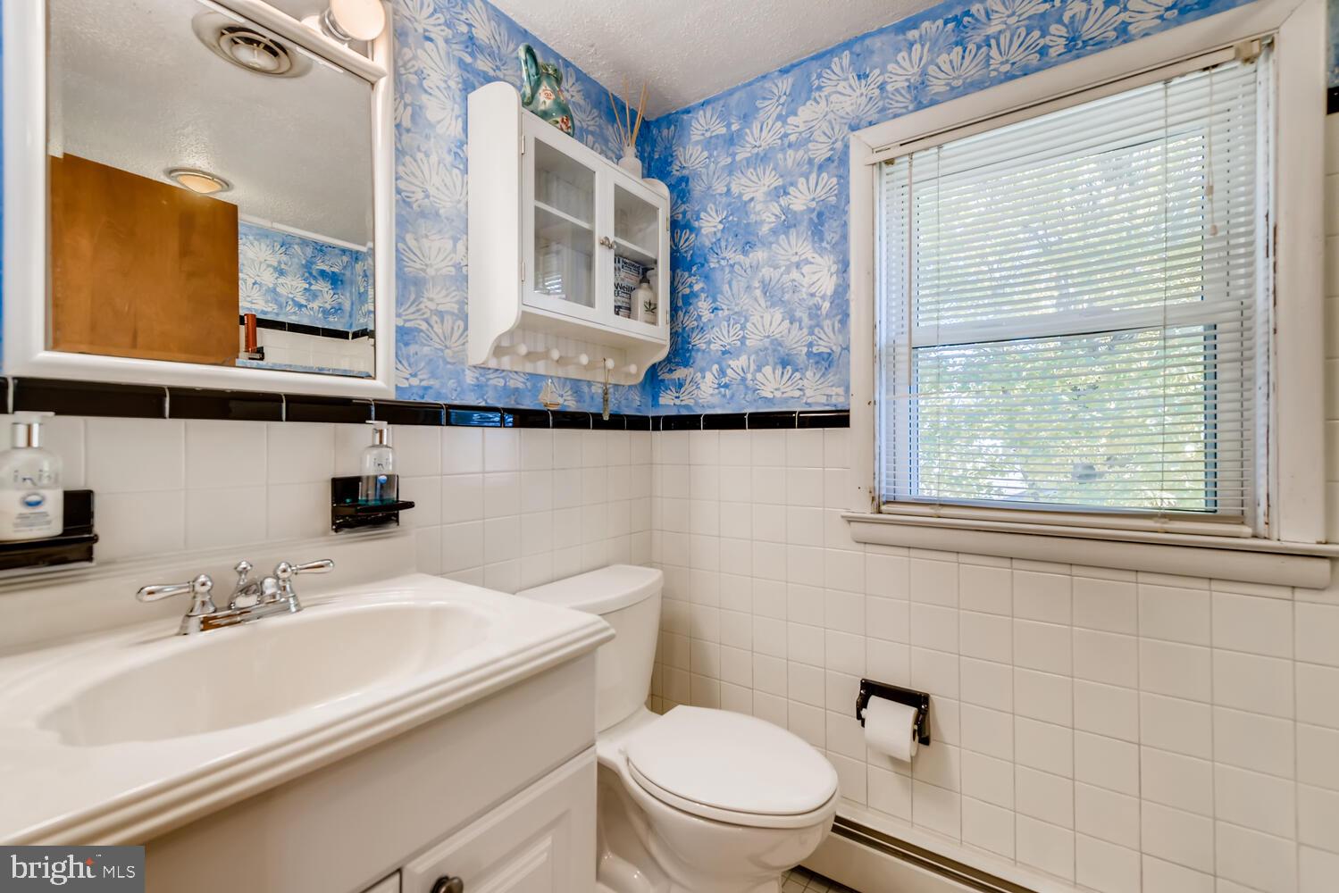 418 Carvel Beach Road Curtis Bay, MD 21226 - Photo 35 of 54 a bathroom with a sink a mirror and a toilet