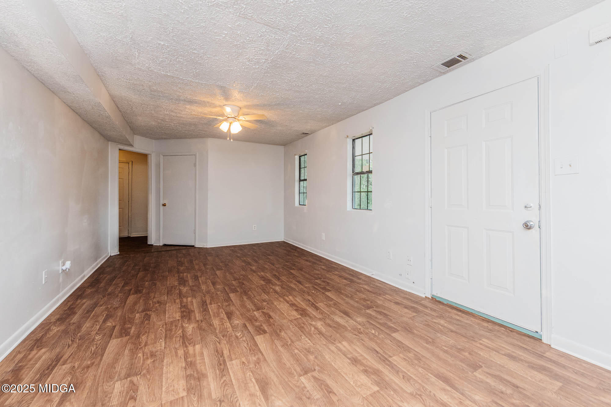 125 Suzanne Drive Warner Robins, GA 31093 - Photo 15 of 50 a view of empty room with wooden floor