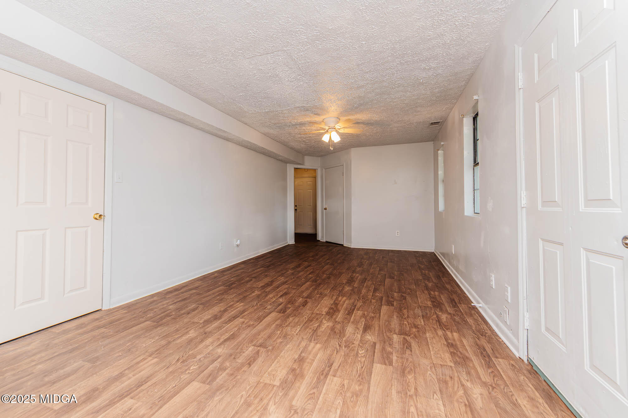 125 Suzanne Drive Warner Robins, GA 31093 - Photo 16 of 50 a view of empty room with wooden floor