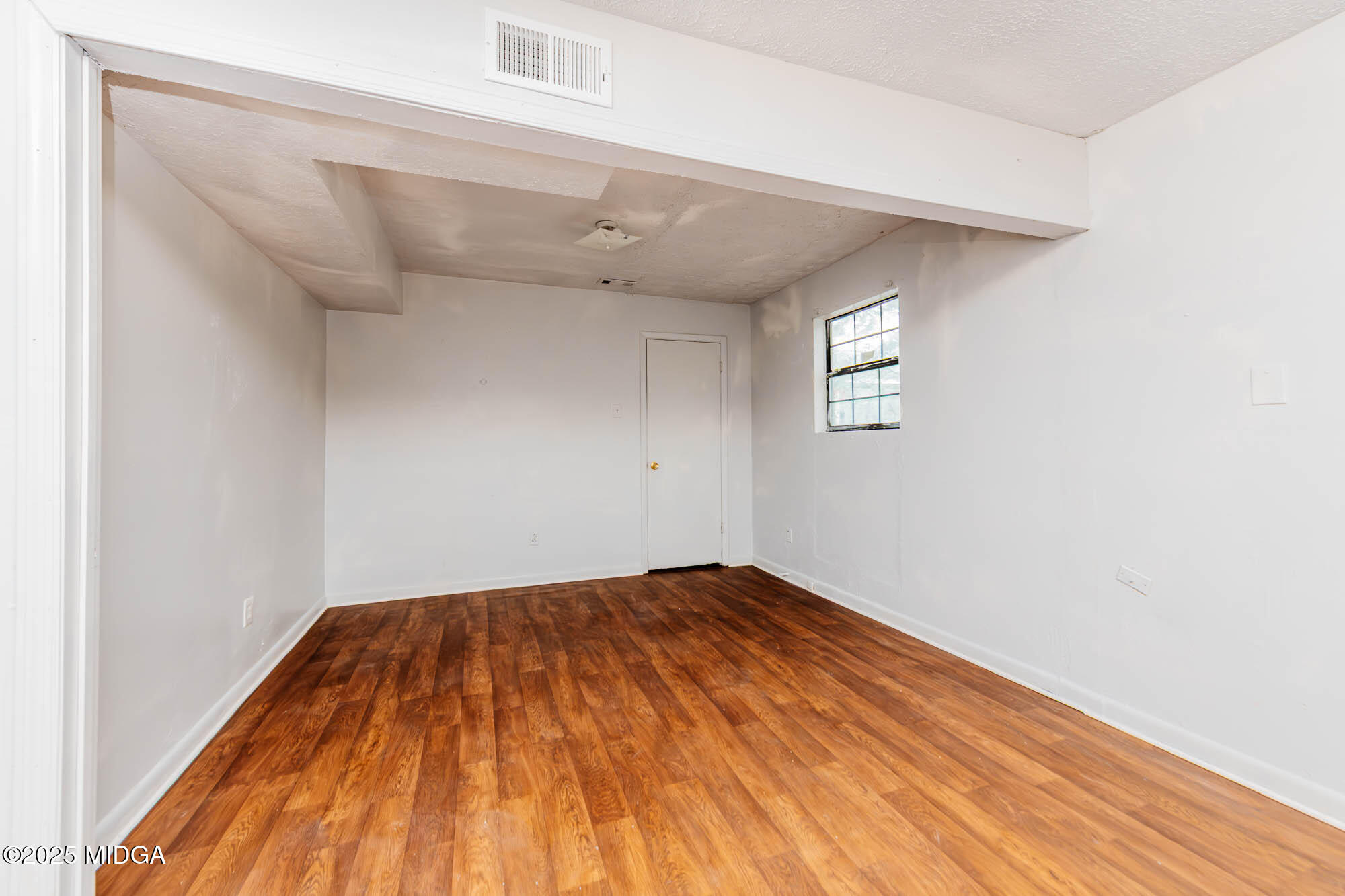 125 Suzanne Drive Warner Robins, GA 31093 - Photo 29 of 50 a view of empty room with wooden floor