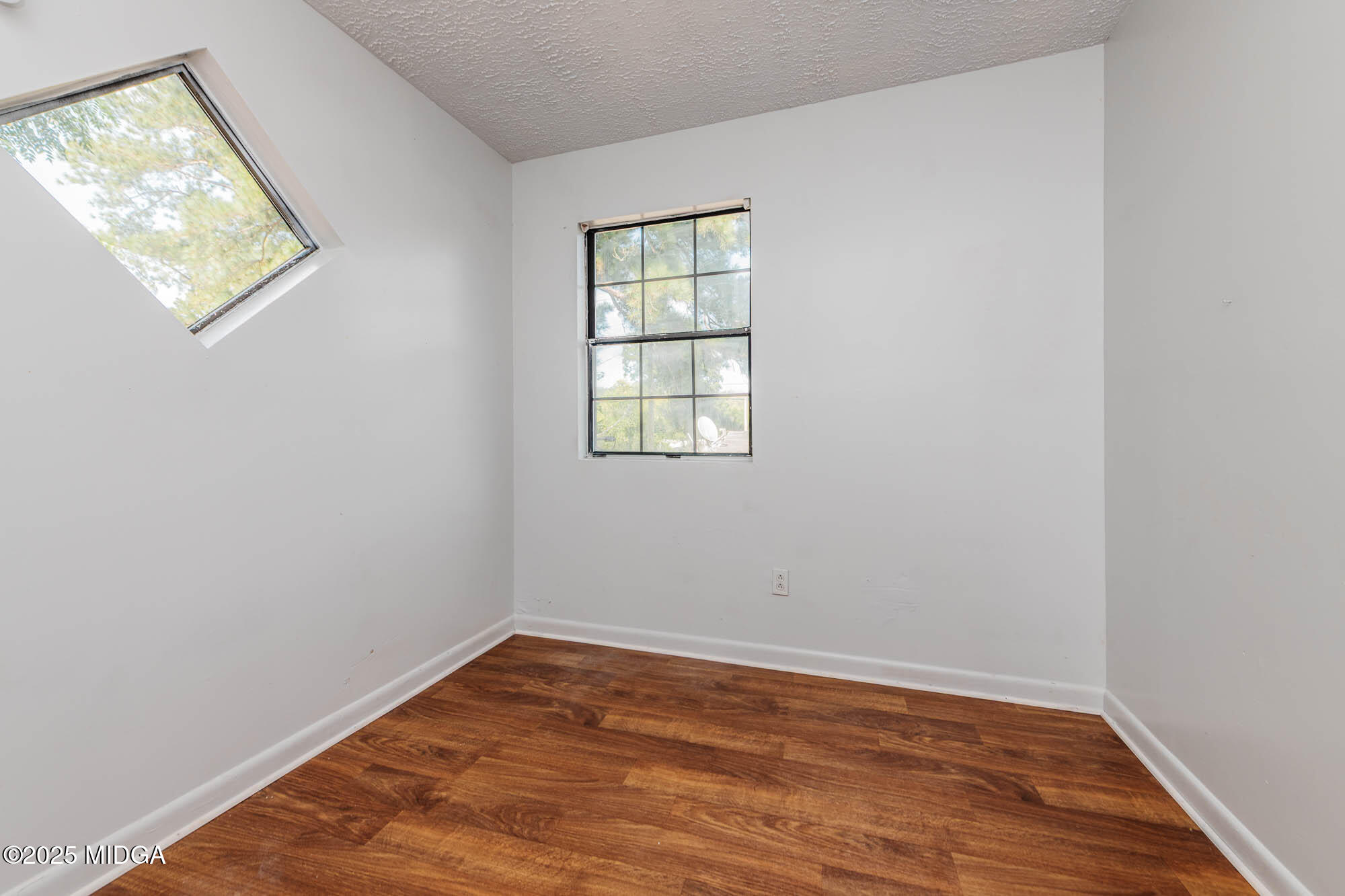 125 Suzanne Drive Warner Robins, GA 31093 - Photo 33 of 50 wooden floor in an empty room with a window