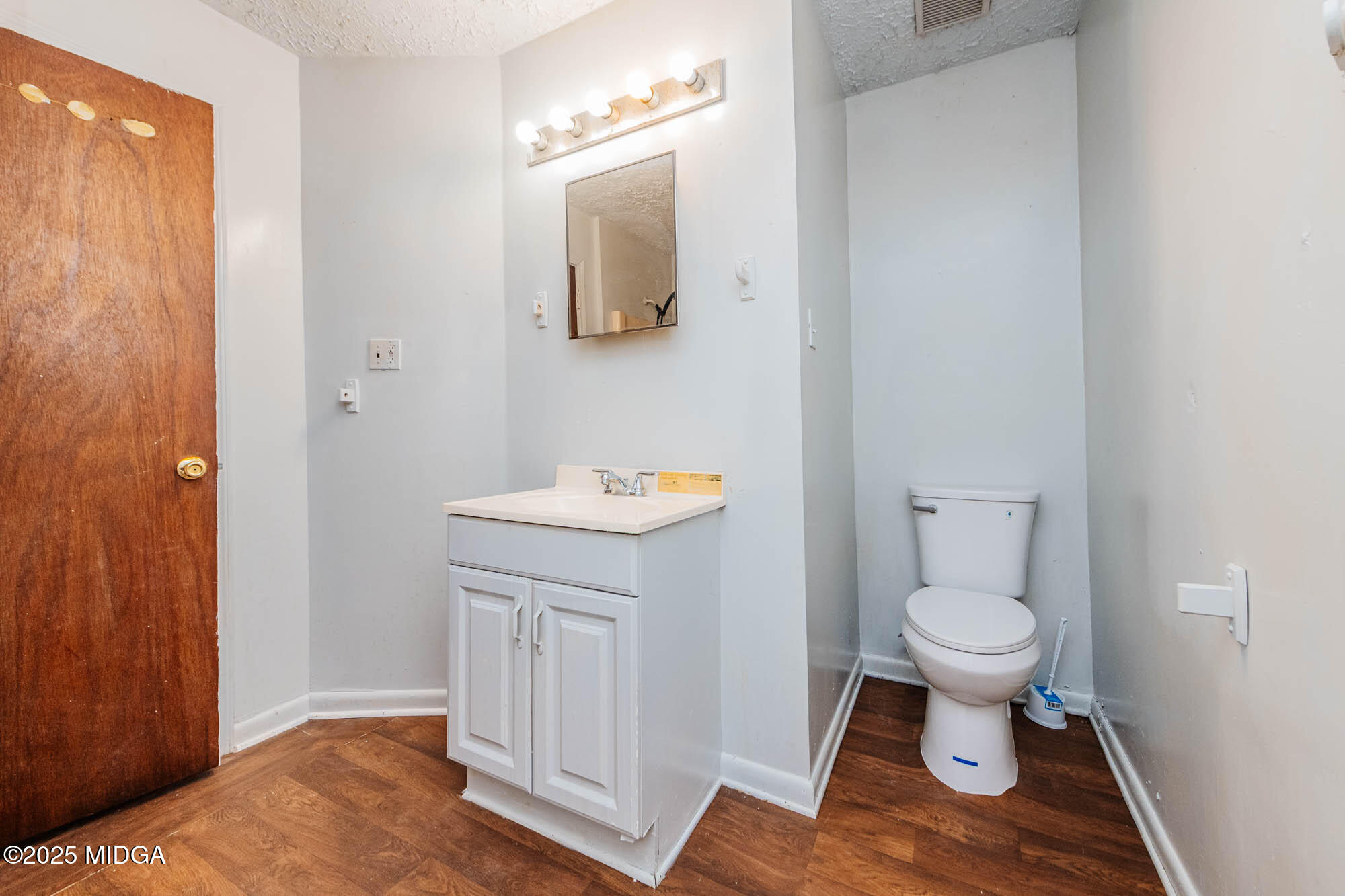 125 Suzanne Drive Warner Robins, GA 31093 - Photo 42 of 50 a bathroom with a sink toilet and a mirror