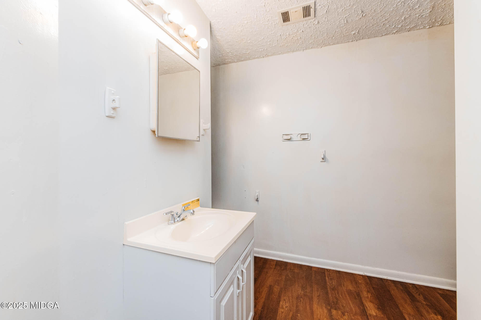 125 Suzanne Drive Warner Robins, GA 31093 - Photo 44 of 50 a bathroom with a sink and a mirror