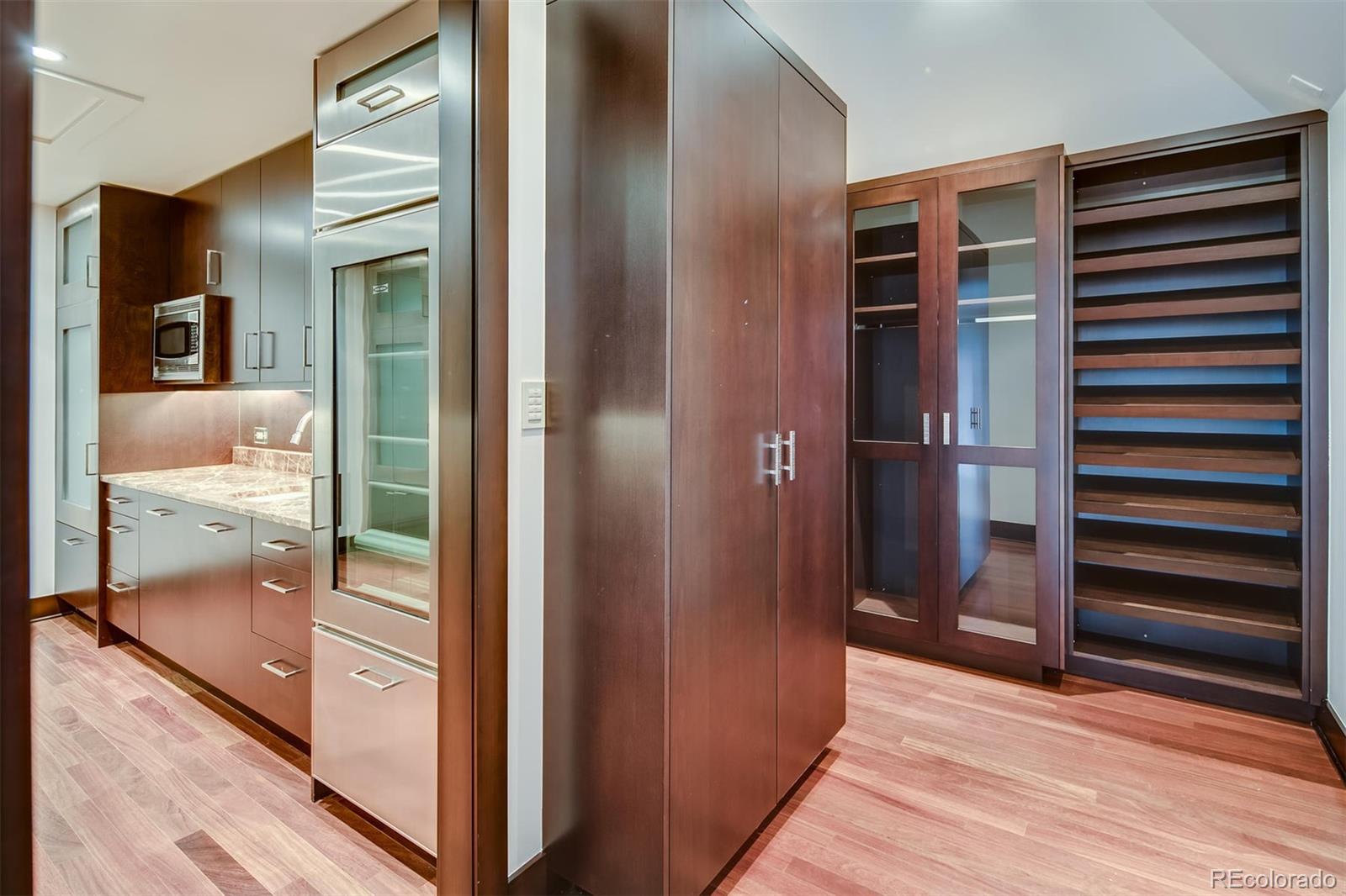 6917 Timbers Drive Evergreen, CO 80439 - Photo 19 of 39 a view of a hallway and a livingroom with wooden floor