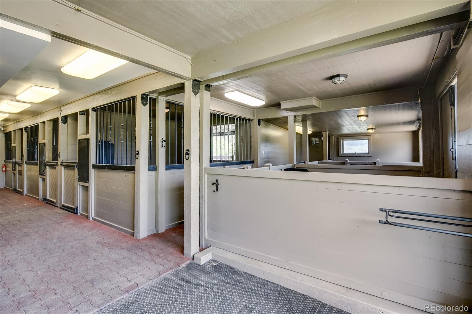 6917 Timbers Drive Evergreen, CO 80439 - Photo 29 of 39 a view of a hallway with stainless steel appliances kitchen island